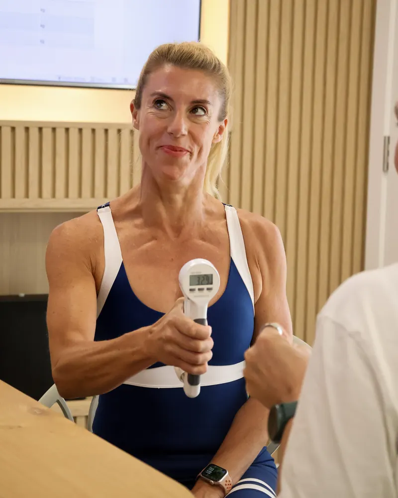 A client holding a grip dynamometer during the functional strength test
